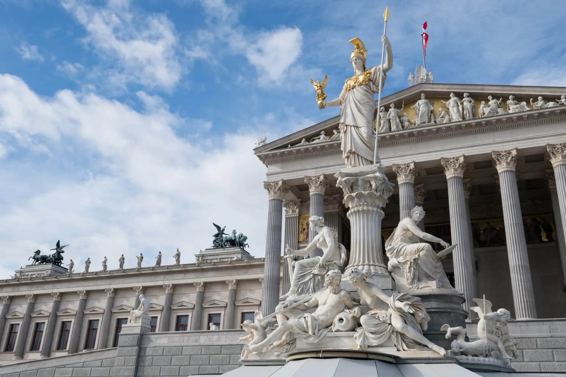 Austrian parliament building with Athena statue and fountain in front. Vienna, capital city of Austria